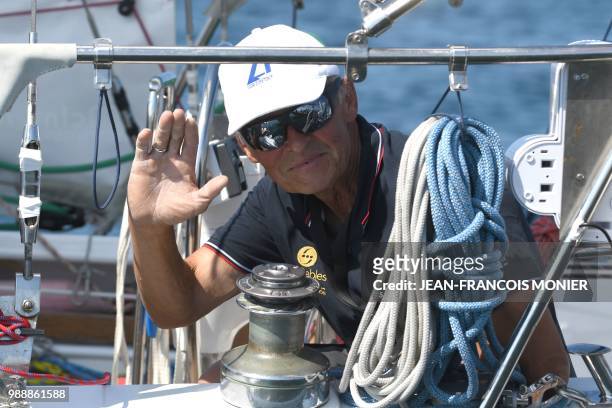 Russia's Igor Zaretskiy on his boat "Esmeralda" competes from Les Sables d'Olonne Harbour on July 1 at the start of the solo around-the-world "Golden...