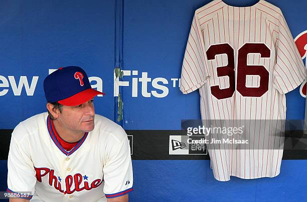 Jamie Moyer of the Philadelphia Phillies sits in the dugout next to a jersey of Phillies Hall of Fame pitcher Robin Roberts prior to playing the St....