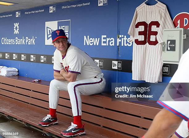 Jamie Moyer of the Philadelphia Phillies sits in the dugout next to a jersey of Phillies Hall of Fame pitcher Robin Roberts prior to playing the St....