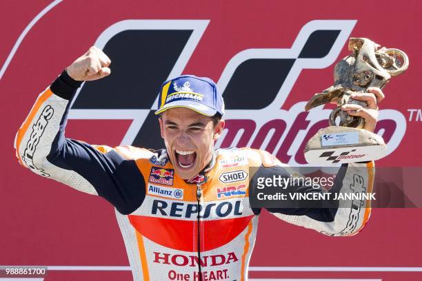 Winner Marc Marquez from Spain celebrates on the podium for the MotoGP race of the motorcycling Grand Prix at TT circuit in Assen, on July 1, 2018. /...