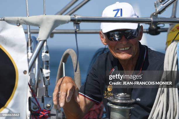 Russia's Igor Zaretskiy on his boat "Esmeralda" competes from Les Sables d'Olonne Harbour on July 1 at the start of the solo around-the-world "Golden...