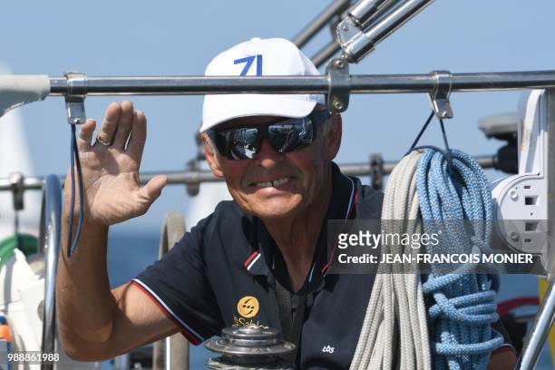 Russia's Igor Zaretskiy on his boat "Esmeralda" competes from Les Sables d'Olonne Harbour on July 1 at the start of the solo around-the-world "Golden...