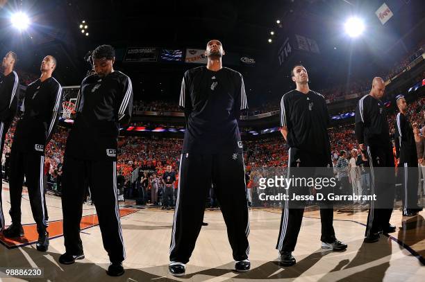 Tim Duncan of the San Antonio Spurs stands for the national anthem before taking on the Phoenix Suns in Game One of the Western Conference Semifinals...