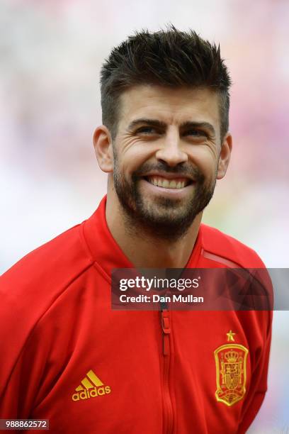Gerard Pique of Spain looks on during the national anthem prior to the 2018 FIFA World Cup Russia Round of 16 match between Spain and Russia at...