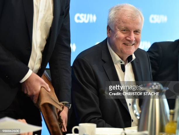 German Interior Minister and Bavarian Christian Social Union politician Horst Seehofer sits at the beginning for a party leadership meeting of the...