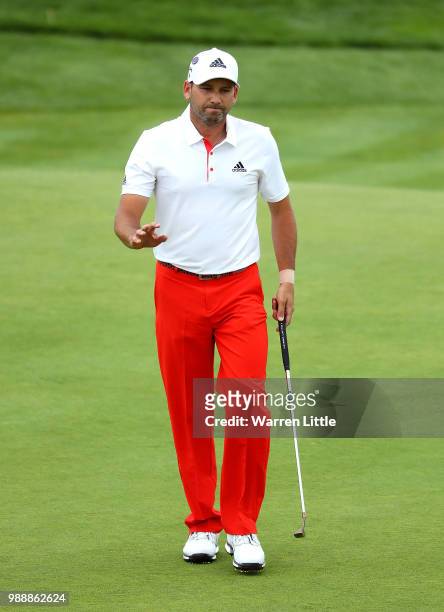 Sergio Garcia of Spain acknowledges the crowd on the 8th hole during day four of the HNA Open de France at Le Golf National on July 1, 2018 in Paris,...