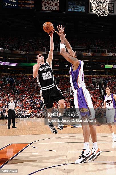 Manu Ginobili of the San Antonio Spurs goes to the basket against Channing Frye of the Phoenix Suns in Game One of the Western Conference Semifinals...