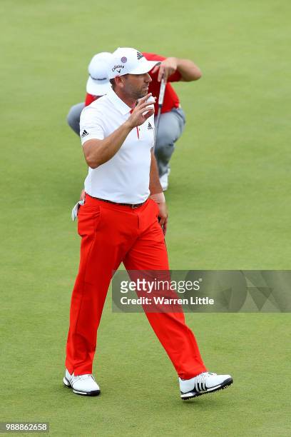 Sergio Garcia of Spain acknowledges the crowd on the 7th hole during day four of the HNA Open de France at Le Golf National on July 1, 2018 in Paris,...