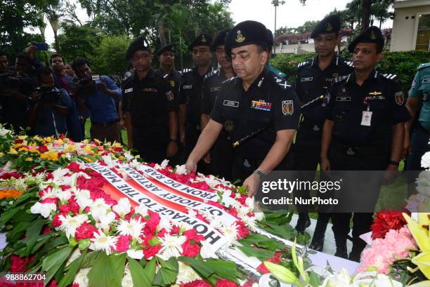 Benazir Ahmed, Director General of Rapid Action Battalion offers his tribute in front of the building once housed the Holey Artisan Bakery, on the...