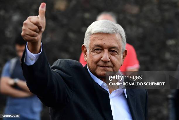 Mexico's presidential candidate Andres Manuel Lopez Obrador for the "Juntos haremos historia" party, gives his thumb up after casting his vote during...