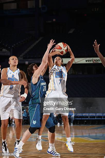 Kristi Toliver of the Chicago Sky puts up a shot over Nuria Martinez of the Minnesota Lynx on May 6, 2010 at the All-State Arena in Rosemont,...