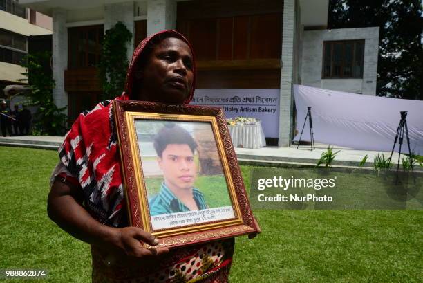 Relative of victims in front of the building once housed the Holey Artisan Bakery, on the second anniversary of the deadly hostage crisis at the...