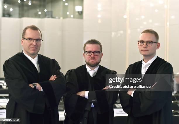 Senior public attorneys Uwe Muehlhoff and Jens Hartung as well as public attorney Christian Seiffge speak in the court room at the Loveparade trial...