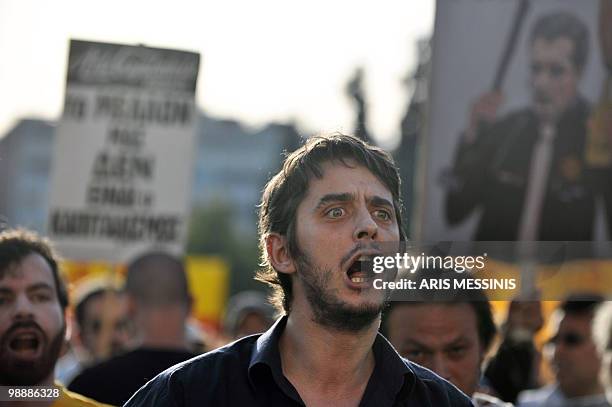 Protestor shouts anti-government slogans in front of the Greek Parliament in central Athens on May 6, 2010. More than 10,000 people demonstrated...