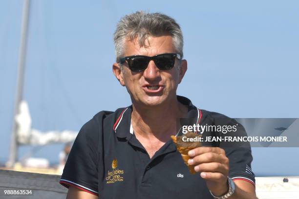 Turkey born and British skipper Ertan Beskardes eats a Croissant on his boat "Lazy Otter" prior to setting sail from Les Sables d'Olonne Harbour on...