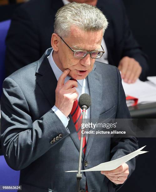 German Minister of the Interior Thomas de Maiziere responds to questions of the delegates concerning the asylum law during a questioning of the...