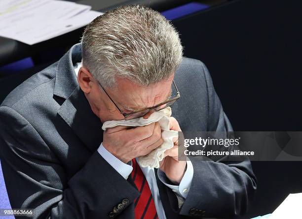 German Minister of the Interior Thomas de Maiziere responds to questions of the delegates concerning the asylum law during a questioning of the...