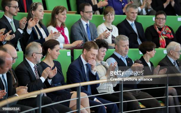 The new Prime Minister of Saxony, Michael Kretschmer , reacts to his election next to his partner Annett Hofmann during the meeting of the state...