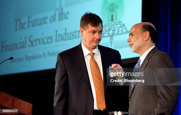 Charles Evans, president of the Federal Reserve Bank of Chicago, left, chats with Ben S. Bernanke, chairman of the U.S. Federal Reserve, at the...