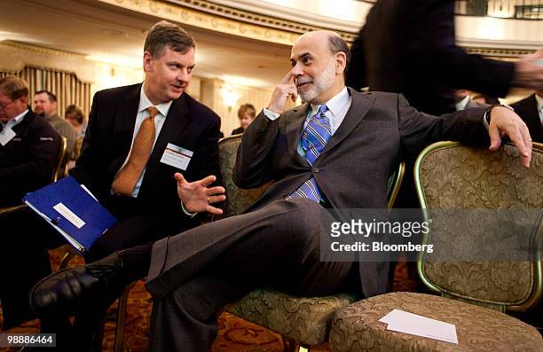 Charles Evans, president of the Federal Reserve Bank of Chicago, left, chats with Ben S. Bernanke, chairman of the U.S. Federal Reserve, at the...