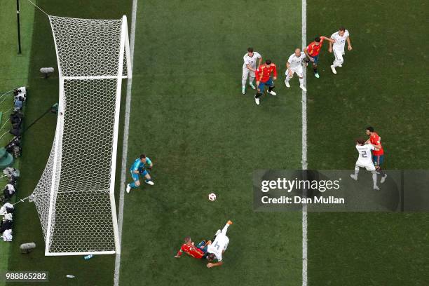 Sergey Ignashevich of Russia scores an own goal to put Spain in front 1-0 during the 2018 FIFA World Cup Russia Round of 16 match between Spain and...