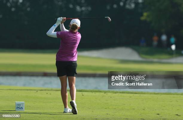 Stacy Lewis watches her tee shot on the third hole during the final round of the KPMG Women's PGA Championship at Kemper Lakes Golf Club on July 1,...