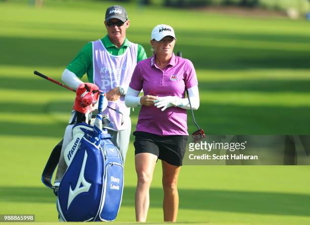 Stacy Lewis waits with her caddie Travis Wilson on the second hole during the final round of the KPMG Women's PGA Championship at Kemper Lakes Golf...
