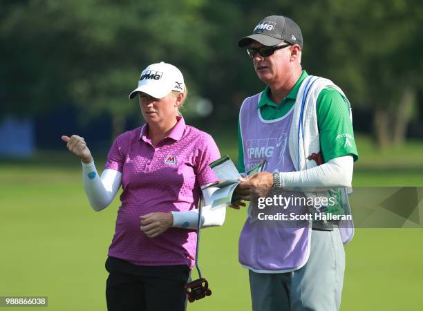 Stacy Lewis waits with her caddie Travis Wilson on the second hole during the final round of the KPMG Women's PGA Championship at Kemper Lakes Golf...