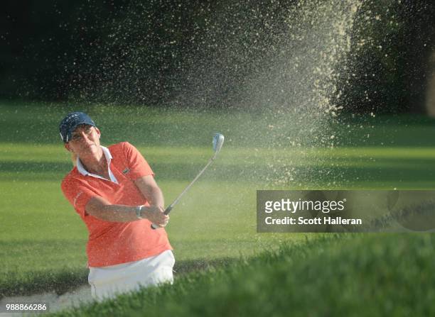 Cristie Kerr hits a fairway bunker shot on the first hole during the final round of the KPMG Women's PGA Championship at Kemper Lakes Golf Club on...