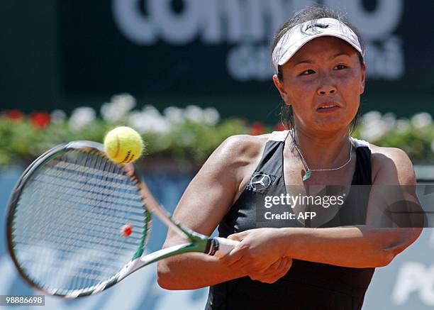 Shuai Peng of China returns to Anabel Garrigues of Spain during their Estoril Open tennis match at Jamor Stadium, in Estoril, outskirts of Lisbon, on...