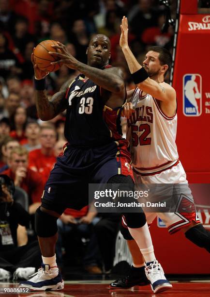 Shaquille O'Neal of the Cleveland Cavaliers moves against Brad Miller of the Chicago Bulls in Game Three of the Eastern Conference Quarterfinals...