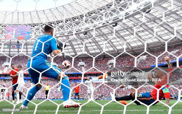 Sergey Ignashevich of Russia scores an own goal to put Spain in front 1-0 during the 2018 FIFA World Cup Russia Round of 16 match between Spain and...