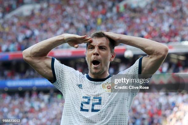 Artem Dzyuba of Russia celebrates after scoring his team's first goal during the 2018 FIFA World Cup Russia Round of 16 match between Spain and...