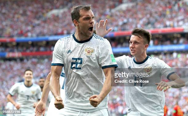 Artem Dzyuba of Russia celebrates after scoring his team's first goal during the 2018 FIFA World Cup Russia Round of 16 match between Spain and...
