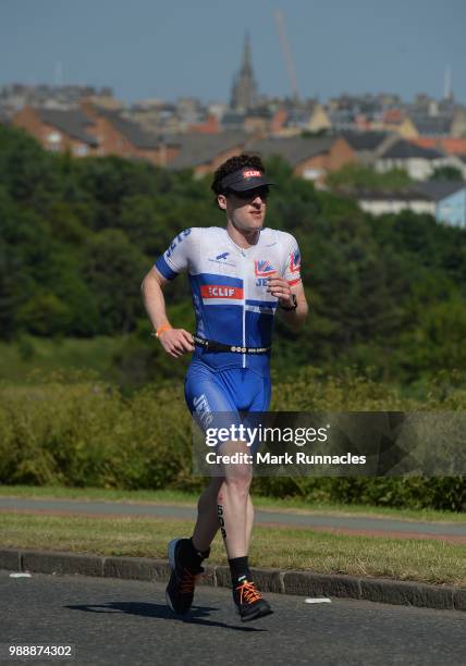 An Athlete competes in the run leg inside Holyrood Park during the IRONMAN 70.3 Edinburgh Triathlon on July 1, 2018 in Edinburgh, Scotland.