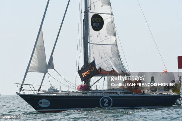 Estonia's skipper Uku Randmaa on his boat "One and All" as he sets sail from Les Sables d'Olonne Harbour on July 1 at the start of the solo...