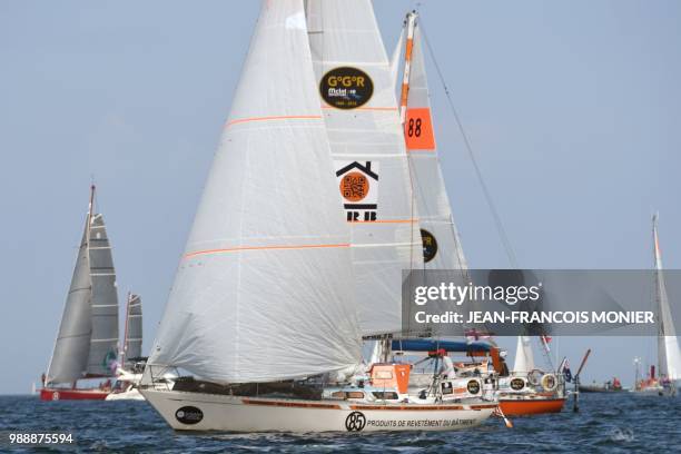 France's Philippe Péché on his boat "PRB" sets sail from Les Sables d'Olonne Harbour on July 1 at the start of the solo around-the-world "Golden...