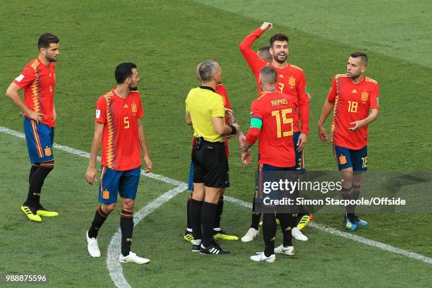 Gerard Pique of Spain argues with referee Bjorn Kuipers after his hand-ball leads to a penalty to Russia during the 2018 FIFA World Cup Russia Round...