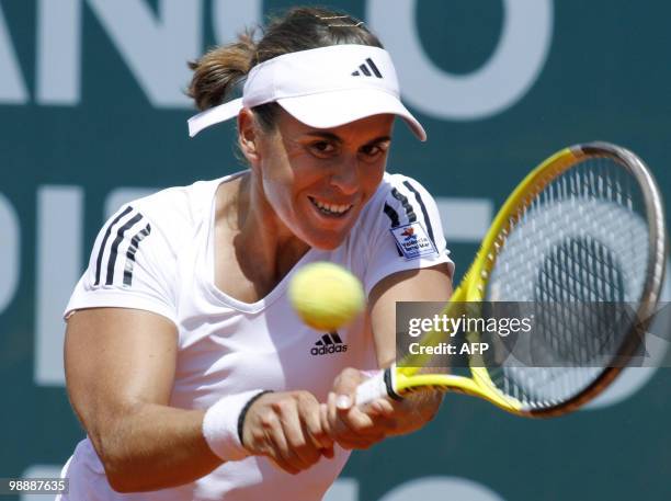 Anabel Garrigues of Spain returns the ball to Shuai Peng of China during their Estoril Open tennis at Jamor Stadium, in Estoril, outskirts of Lisbon,...