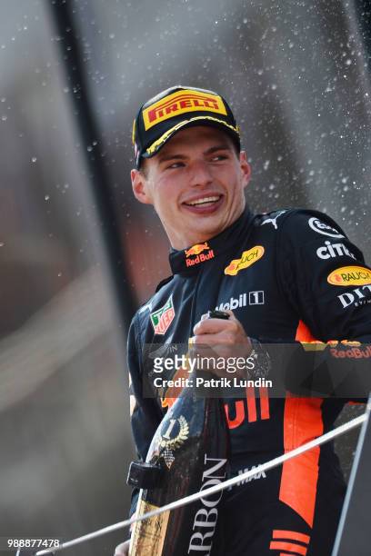 Race winner Max Verstappen of Netherlands and Red Bull Racing celebrates on the podium during the Formula One Grand Prix of Austria at Red Bull Ring...