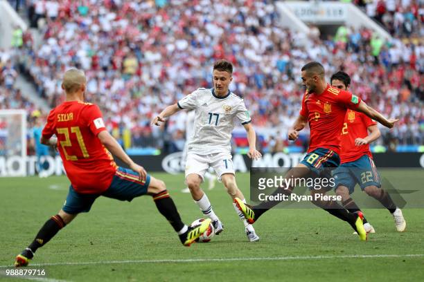 David Silva, Koke and Isco of Spain put pressure on Aleksandr Golovin of Russia during the 2018 FIFA World Cup Russia Round of 16 match between Spain...
