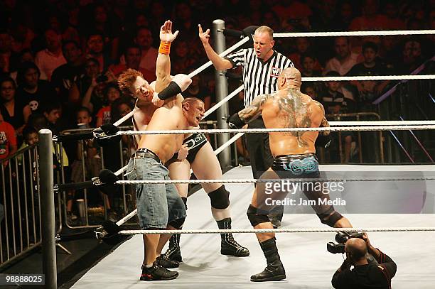 Wrestling fighters Sheanus , John Cena and Batista fight during the WWE RAW wrestling function at Arena Monterrey on May 5, 2010 in Monterrey, Mexico.