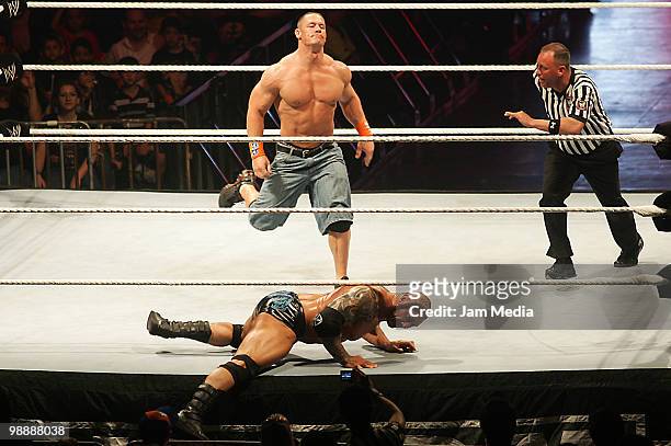 Wrestling fighters John Cena and Batista fight during the WWE RAW wrestling function on May 5, 2010 in Monterrey, Mexico.