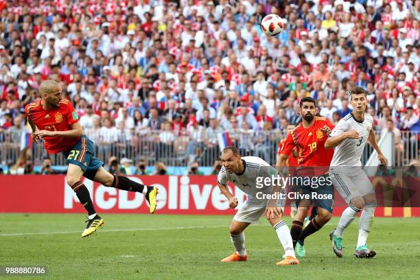 David Silva of Spain heads the ball wide during the 2018 FIFA World Cup Russia Round of 16 match between Spain and Russia at Luzhniki Stadium on July...
