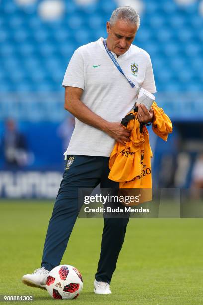 Head coach Tite controls the ball during a Brazil training session ahead of the Round 16 match against Mexico at Samara Arena on July 1, 2018 in...