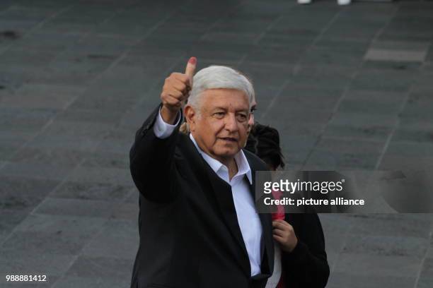 July 2018, Mexico, Mexiko City: Politician Andres Manuel Lopez Obrador, presidential candidate for the party Morena, gives a thumbs-up after casting...