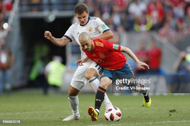 Roman Zobnin of Russia, David Silva of Spain during the 2018 FIFA World Cup Russia round of 16 match between Spain and Russia at the Luzhniki Stadium...