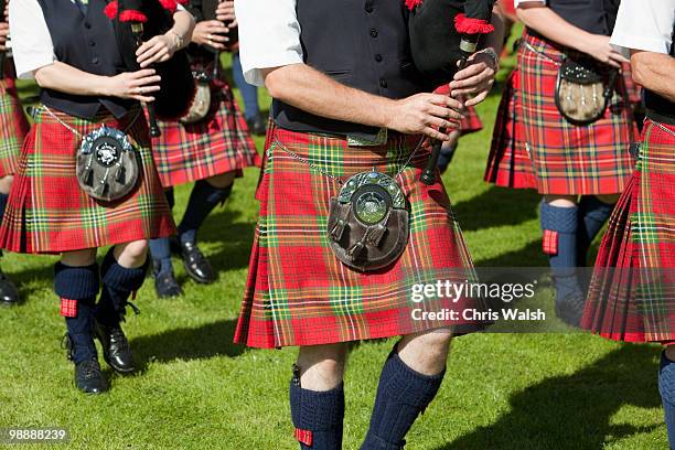 bagpipe band, pitlochry, scotland - traditional musician stock pictures, royalty-free photos & images