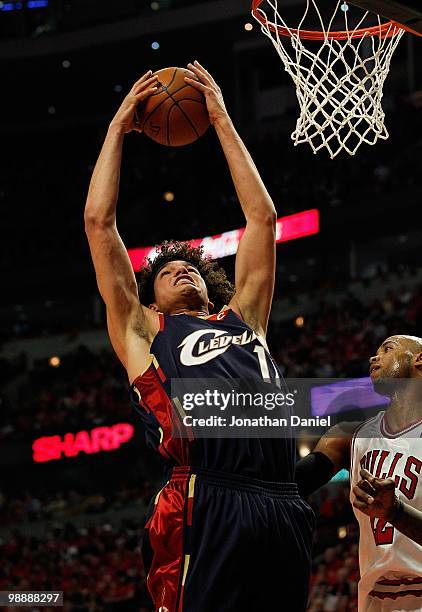 Anderson Varejao of the Cleveland Cavaliers grabs a rebound over Taj Gibson of the Chicago Bulls in Game Three of the Eastern Conference...