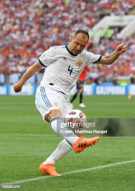 Sergey Ignashevich of Russia controls the ball during the 2018 FIFA World Cup Russia Round of 16 match between Spain and Russia at Luzhniki Stadium...